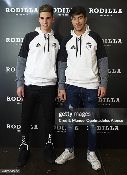 Santi Mina and Carlos Soler players of Valencia CF attend the Rodilla opening on January 25, 2017 in Valencia, Spain.