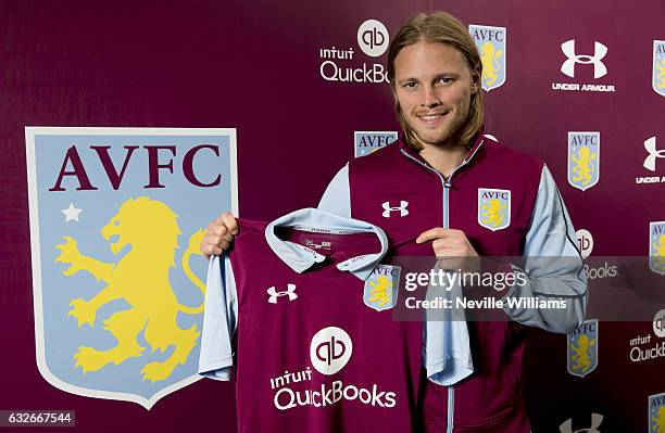 New signing Birkir Bjarnason of Aston Villa poses for a picture at the club's training ground at Bodymoor Heath on January 25, 2017 in Birmingham,...