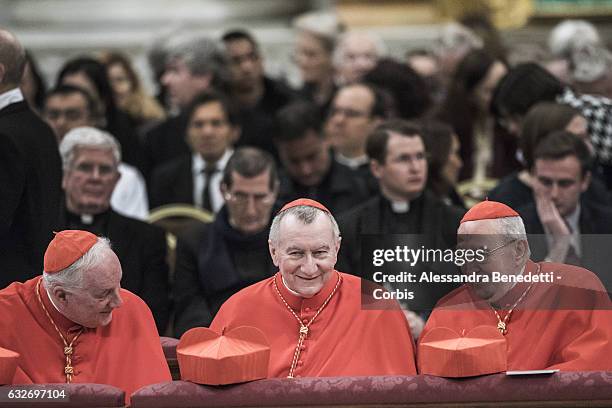 Cardinal Marc Ouellet, Vatican State Secretary Pietro Parolin and Cardinal Augusto Vallini talk as Pope Francis leads the Vespers mass on the...