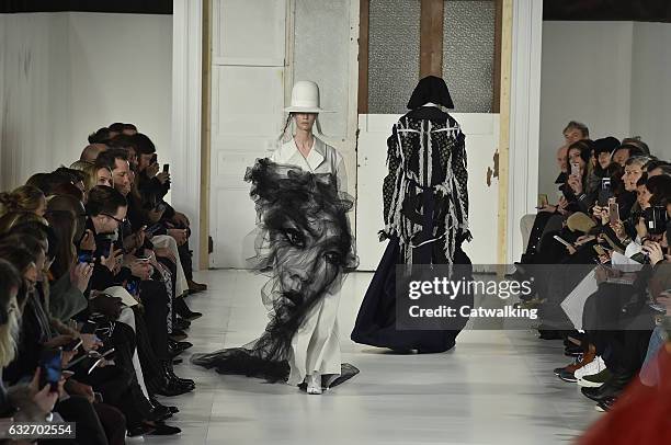 Model walks the runway at the Maison Margiela Spring Summer 2017 fashion show during Paris Haute Couture Fashion Week on January 25, 2017 in Paris,...