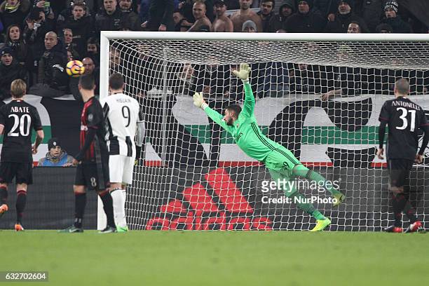 Milan goalkeeper Gianluigi Donnarumma dives for the ball during the Coppa Italia quarter finals football match JUVENTUS - MILAN on at the Juventus...