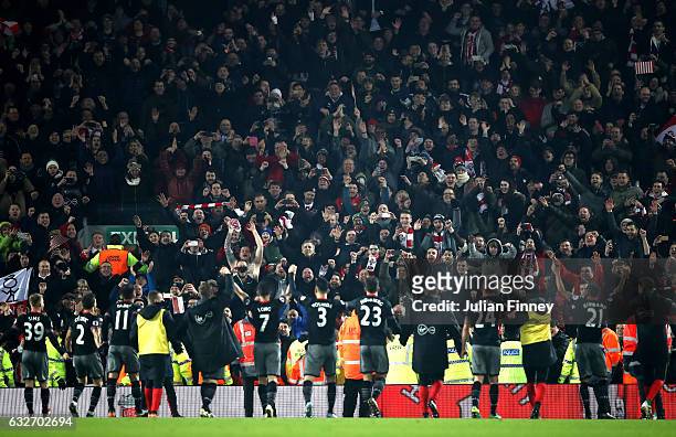 Southampton players celebrate victory with their supporters following the EFL Cup Semi-Final Second Leg match between Liverpool and Southampton at...