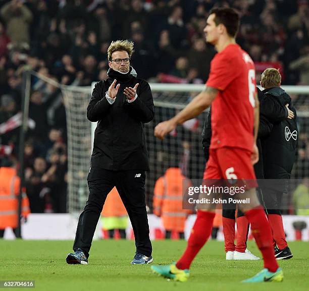 Jurgen Klopp manager of Liverpool shows his appreciation to the fans at the end of the EFL Cup Semi-Final second leg match between Liverpool and...