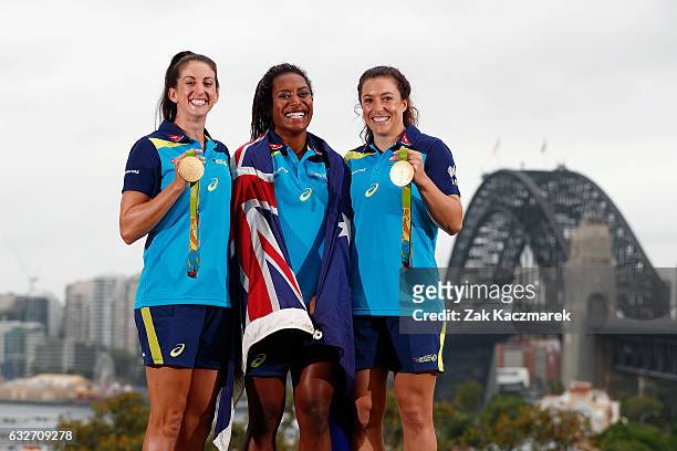 Alicia Quirk, Ellia Green and Emilee Cherry pose with Olympic Gold Medals at Observatory Hill on January 26, 2017 in Sydney, Australia. The...