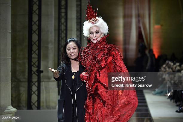 Designer Guo Pei and Carmen Dell'Orefice walk the runway during the Guo Pei Spring Summer 2017 show as part of Paris Fashion Week on January 25, 2017...
