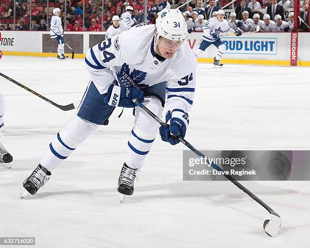 Auston Matthews of the Toronto Maple Leafs skates with the puck during an NHL game against the Detroit Red Wings at Joe Louis Arena on January 25,...