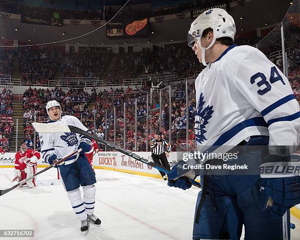 Auston Matthews of the Toronto Maple Leafs celebrates his first period goal with teammate Zach Hyman in the view of goaltender Petr Mrazek of the...
