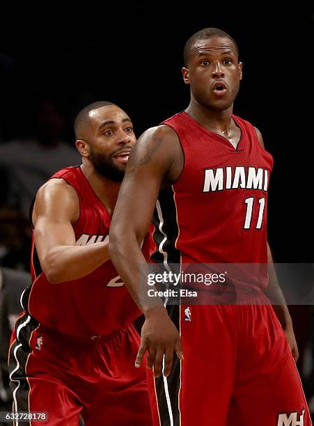 Dion Waiters of the Miami Heat celebrates his three point shot in the final minutes of the game with teammate Wayne Ellington in the fourth quarter...