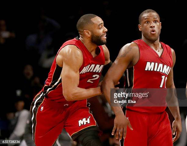 Dion Waiters of the Miami Heat celebrates his three point shot in the final minutes of the game with teammate Wayne Ellington in the fourth quarter...