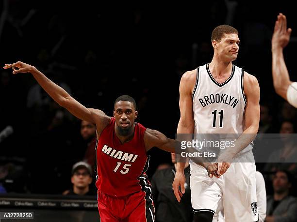 Okaro White of the Miami Heat celebrates his three point shot as Brook Lopez of the Brooklyn Nets reacts in the fourth quarter at the Barclays Center...