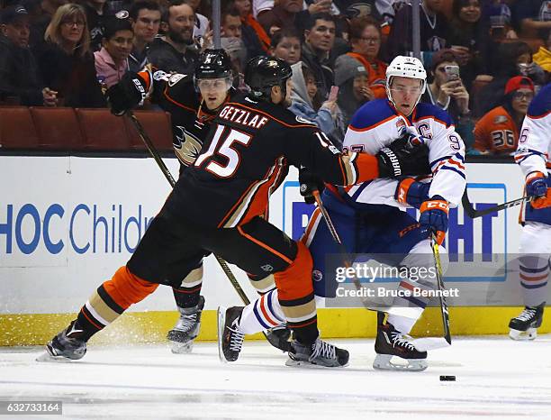 Ryan Getzlaf of the Anaheim Ducks reaches out to slow up Connor McDavid of the Edmonton Oilers during the second period at the Honda Center on...