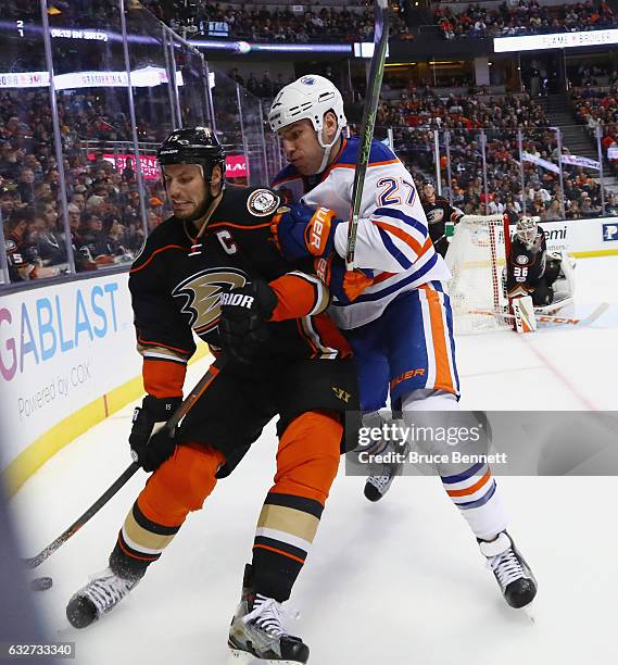 Ryan Getzlaf of the Anaheim Ducks is hit by Milan Lucic of the Edmonton Oilers during the second period at the Honda Center on January 25, 2017 in...