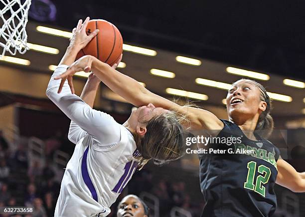 Guard Alexis Prince of the Baylor Bears fouls guard Kayla Goth of the Kansas State Wildcats, driving to the basket during the second half on January...