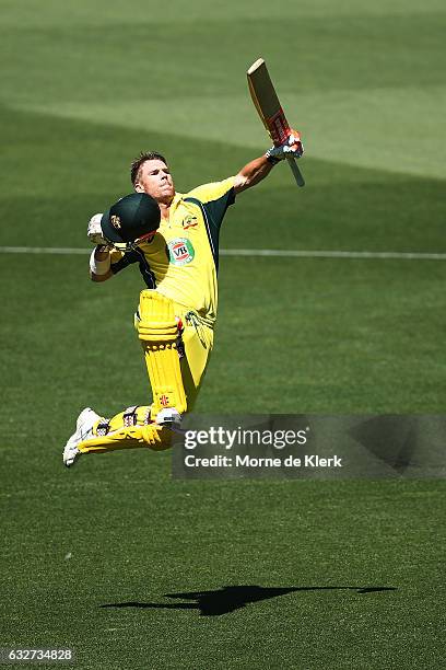 David Warner of Australia celebrates after reaching 100 runs during game five of the One Day International series between Australia and Pakistan at...