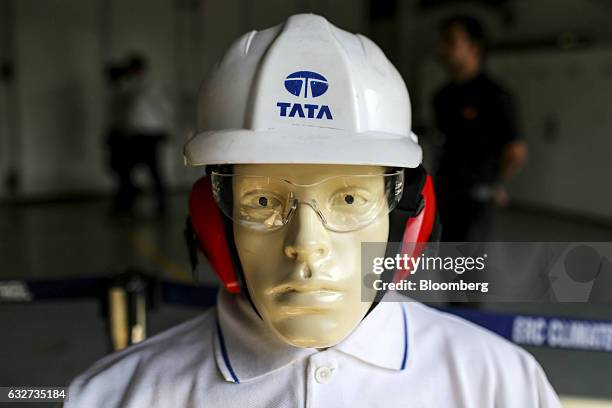 Mannequin wearing a hard hat featuring the Tata Motors Ltd. Logo is displayed during the launch of a new range of electric and hybrid buses at the...
