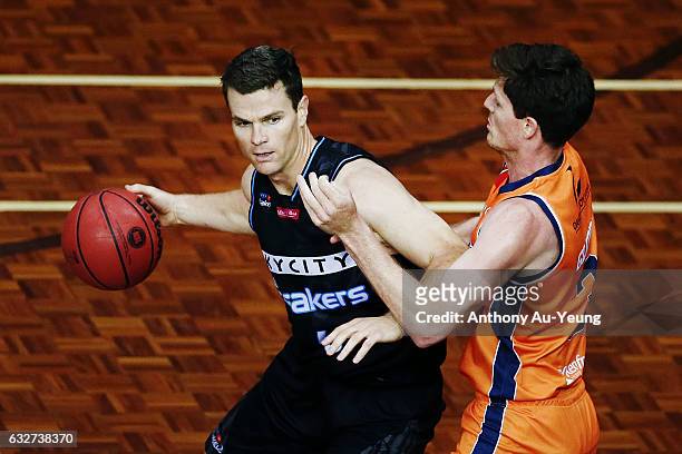 Kirk Penney of the Breakers competes against Cameron Gliddon of the Taipans during the round 17 NBL match between the New Zealand Breakers and the...
