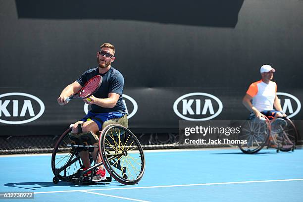 Maikel Scheffers of the Netherlands and Ben Weekes of Australia compete against Joachim Gerard of Belgium and Gordon Reid of Great Britain during the...