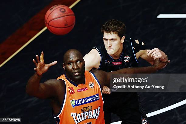 Nathan Jawai of the Taipans competes against Rob Loe of the Breakers during the round 17 NBL match between the New Zealand Breakers and the Cairns...