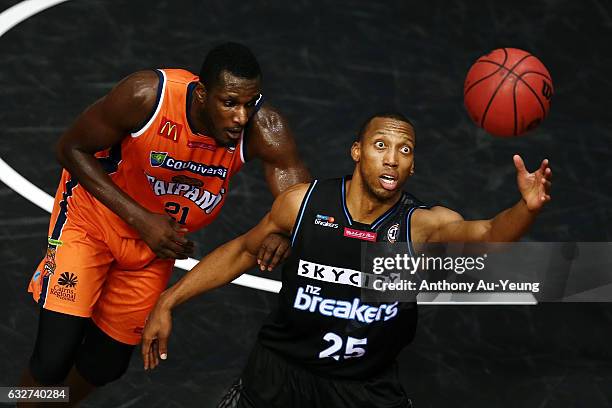 Akil Mitchell of the Breakers looks to catch a pass against Nnanna Egwu of the Taipans during the round 17 NBL match between the New Zealand Breakers...