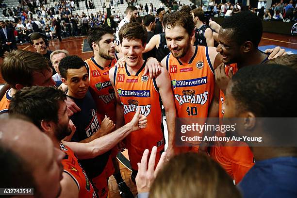 Cameron Gliddon and Alex Loughton of the Taipans celebrate with the team after winning the round 17 NBL match between the New Zealand Breakers and...