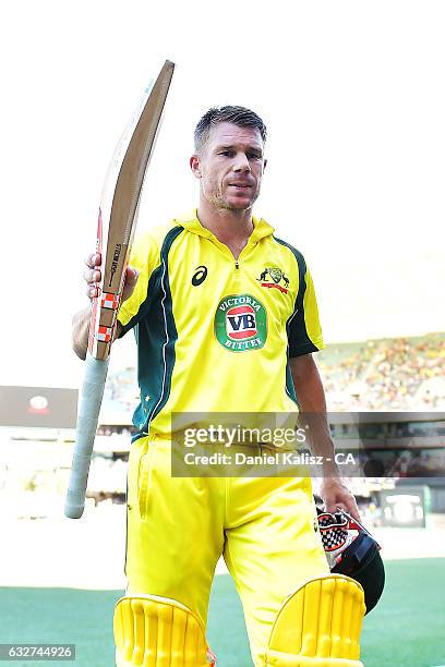 David Warner of Australia reacts as he walks from the field after being caught during game five of the One Day International series between Australia...