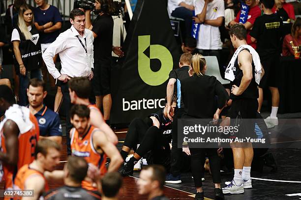 Players and staff members of the Breakers show concerns as they gather around Akil Mitchell who suffers a serious eye injury during the round 17 NBL...