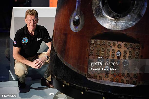 British astronaut Tim Peake poses with the Soyuz TMA-19M descent module which he used to return from the International Space Station, as it is...