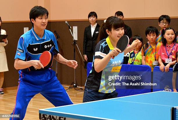 Ai Fukuhara And Chiang Hung-Chieh attend a table tennis class for children on January 25, 2017 in Matsuyama, Ehime, Japan.