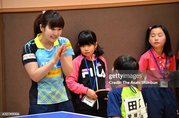 Ai Fukuhara And Chiang Hung-Chieh attend a table tennis class for children on January 25, 2017 in Matsuyama, Ehime, Japan.