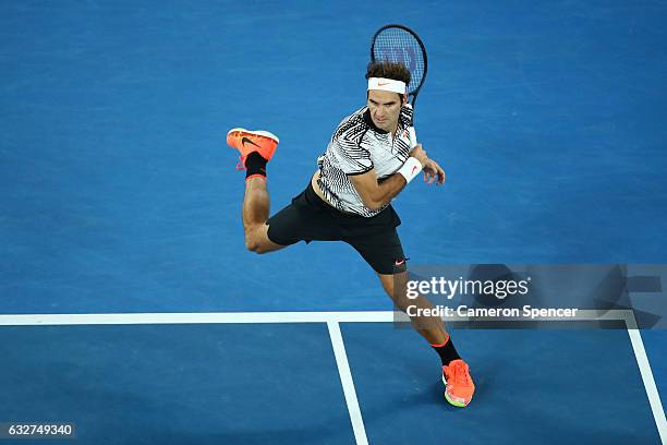 Roger Federer of Switzerland plays a forehand in his semifinal match against Stan Wawrinka of Switzerland on day 11 of the 2017 Australian Open at...