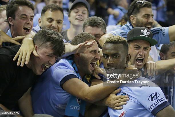 Bernie Ibini-Isei of Sydney FC celebrates a goal with fans during the round 17 A-League match between the Melbourne Victory and Sydney FC at Etihad...