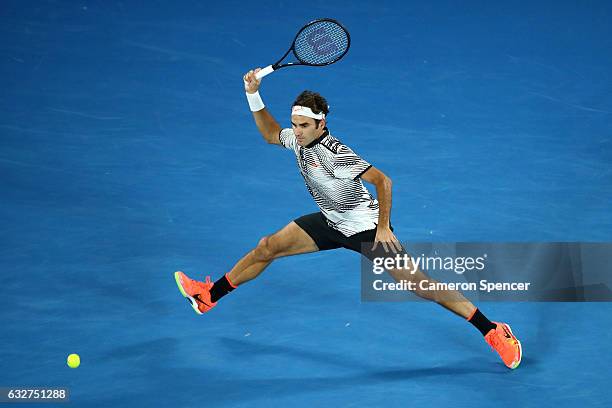 Roger Federer of Switzerland plays a forehand in his semifinal match against Stan Wawrinka of Switzerland on day 11 of the 2017 Australian Open at...