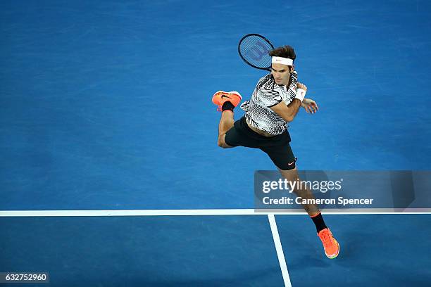 Roger Federer of Switzerland plays a forehand in his semifinal match against Stan Wawrinka of Switzerland on day 11 of the 2017 Australian Open at...