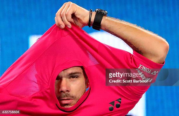 Stan Wawrinka of Switzerland changes his shirt in his semifinal match against Roger Federer of Switzerland on day 11 of the 2017 Australian Open at...