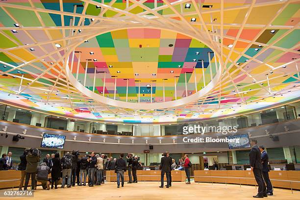 Journalists gather in the main meeting room during a Eurogroup meeting of euro-area finance ministers in the Europa building in Brussels, Belgium, on...