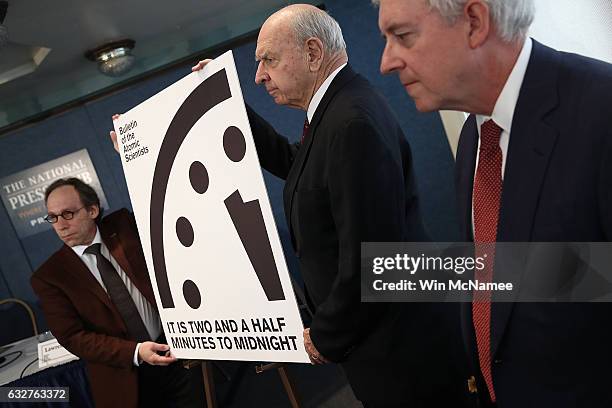 Members of the Bulletin of Atomic Scientists unveil the 2017 time for the "Doomsday Clock" January 26, 2017 in Washington, DC. For the first time in...