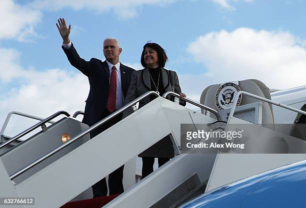 Vice President Mike Pence waves with his wife Karen before they board Air Force Two January 26, 2017 at Joint Base Andrews in Maryland. Vice...