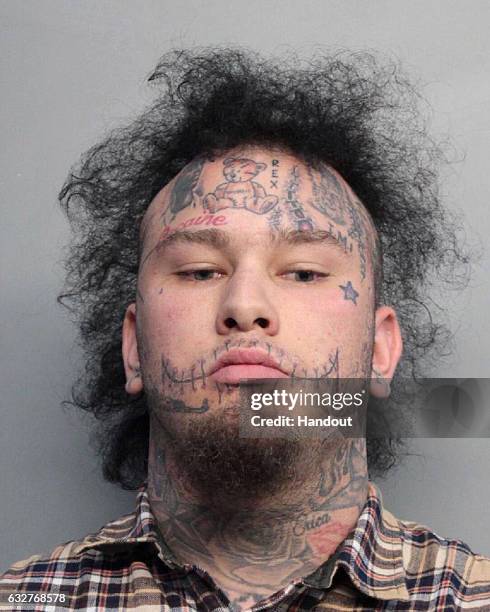 In this handout photo provided by the The Miami-Dade Police Department, rapper Phillip Katsabanis, aka Stitches, is seen in a police booking photo...