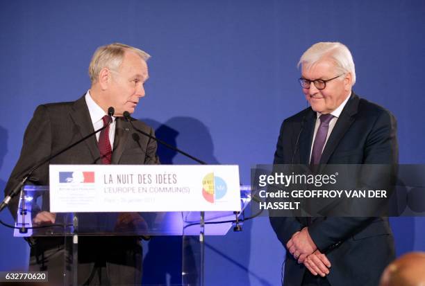French Foreign Minister Jean-Marc Ayrault delivers a speech next to German Foreign Minister Frank-Walter Steinmeier during the launch of the second...