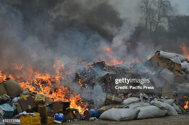 Customs officials burn piles of drugs on International Customs Day. Pakistani customs officials destroyed narcotics and other contraband items from...
