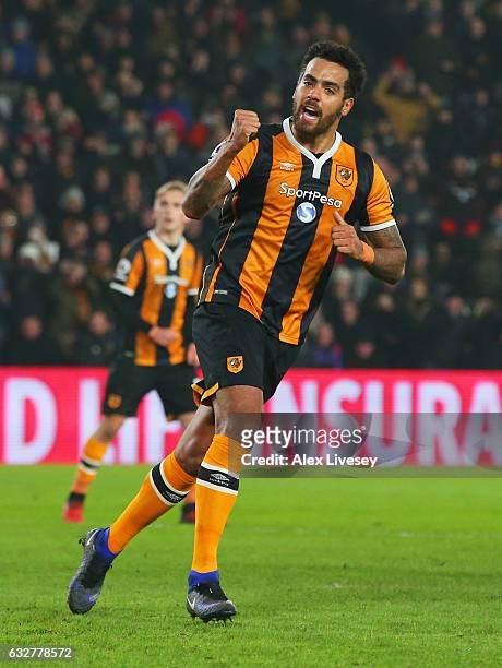 Tom Huddlestone of Hull City celebrates as he scores their first goal from the penalty spot during the EFL Cup Semi-Final second leg match between...