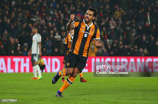 Tom Huddlestone of Hull City celebrates as he scores their first goal from the penalty spot during the EFL Cup Semi-Final second leg match between...