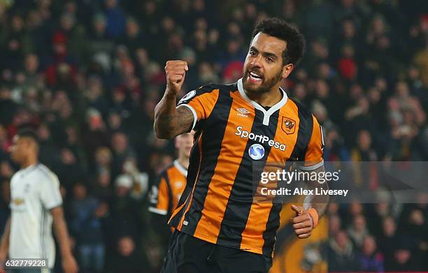 Tom Huddlestone of Hull City celebrates as he scores their first goal from the penalty spot during the EFL Cup Semi-Final second leg match between...