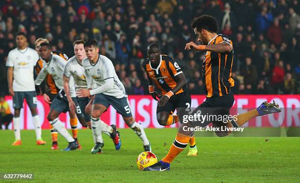 Tom Huddlestone of Hull City scores their first goal from the penalty spot during the EFL Cup Semi-Final second leg match between Hull City and...