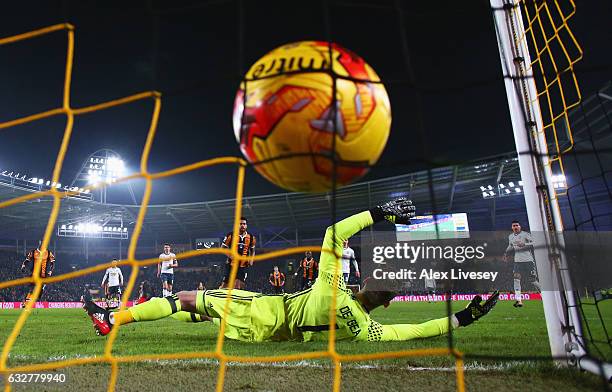 Tom Huddlestone of Hull City scores their first goal from the penalty spot past goakeeper David De Gea of Manchester United during the EFL Cup...