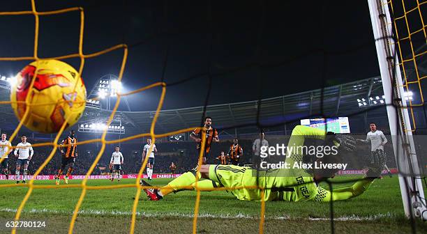 Tom Huddlestone of Hull City scores their first goal from the penalty spot past goakeeper David De Gea of Manchester United during the EFL Cup...