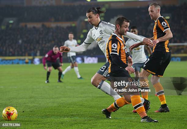 Zlatan Ibrahimovic of Manchester United in action with Shaun Maloney and David Meyler of Hull City during the EFL Cup Semi-Final second leg match...