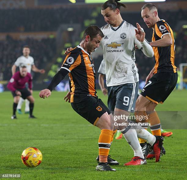 Zlatan Ibrahimovic of Manchester United in action with Shaun Maloney and David Meyler of Hull City during the EFL Cup Semi-Final second leg match...