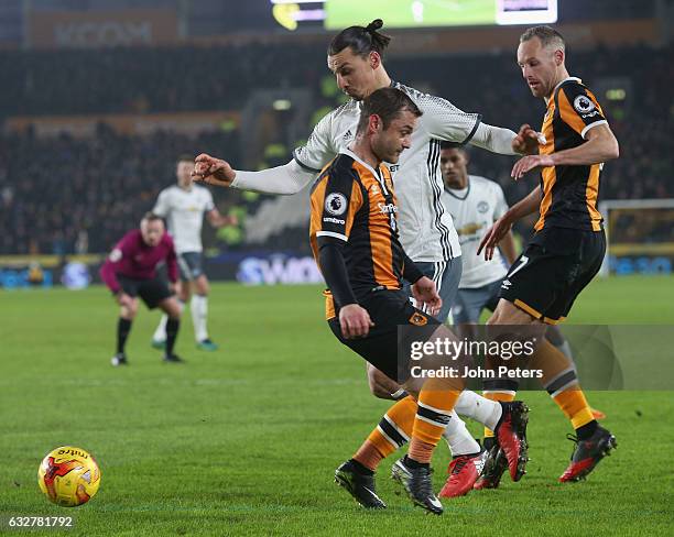 Zlatan Ibrahimovic of Manchester United in action with Shaun Maloney and David Meyler of Hull City during the EFL Cup Semi-Final second leg match...