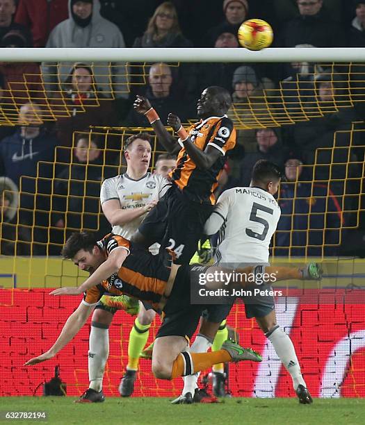 Marcos Rojo of Manchester United fouls Harry McGuire of Hull City to give away a penalty during the EFL Cup Semi-Final second leg match between Hull...